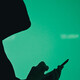 silhouette of hooded figure on phone