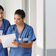 nurses with paper charts