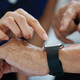 nurse helps man with wearable device