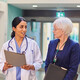 Hospital workers walking down a hallway