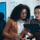 two IT leaders read document on tablet