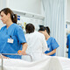 nurses talk to patients on gurneys