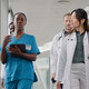 clinicians walking in hospital hallway