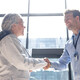 two people shaking hands