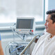 nurse talks with patient in hospital room