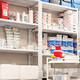 man grabs supplies in pharmacy supply room
