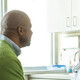 doctor talks with patient in exam room