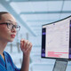 clinician looks at data on a monitor