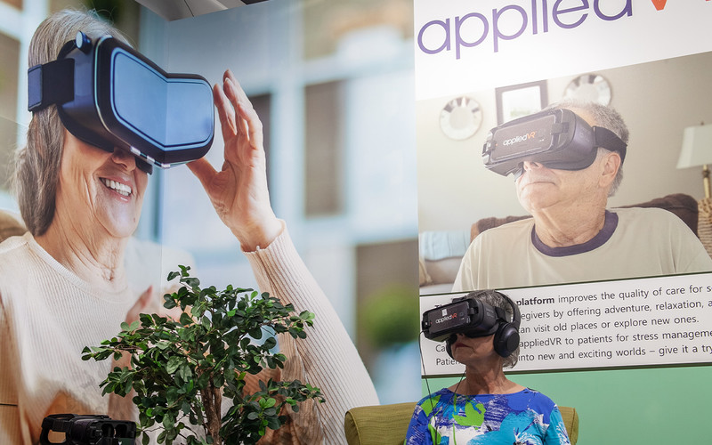 Older adult woman wears VR headset