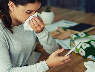 Girl sick with flu on her smartphone