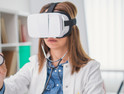 doctor wearing a virtual headset and using a stethoscope.