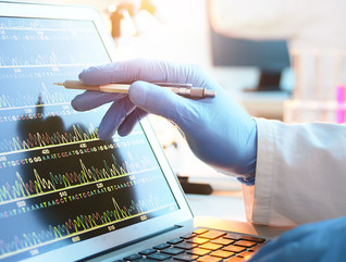 A scientist looking at a DNA sequence