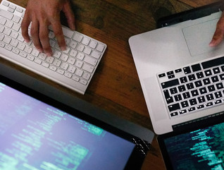 High angle shot of a person working on computer code