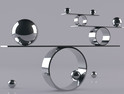 Reflective balls balancing on metal shelves. Balancing concept