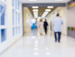 Blurred hospital hallway.