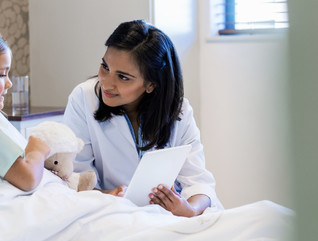 Doctor shares tablet with patient.