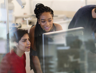 Engineers look at computer