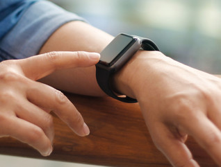 Man uses smartwatch
