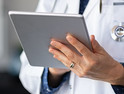 Doctor with tablet