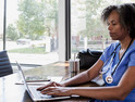 Nurse using laptop for telehealth