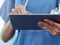 nurse using tablet in hospital