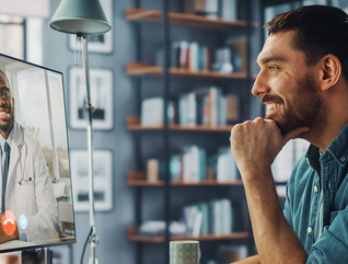 man attends telehealth visit with doctor