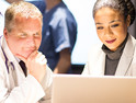healthcare and IT leaders collaborate over laptop