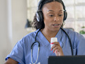 Nurse working with patient via telehealth