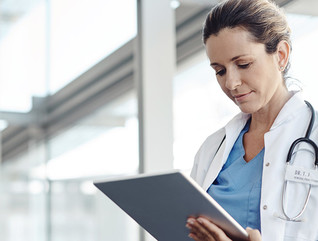 Doctor using a digital tablet