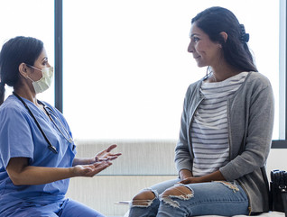 Doctor talking to patient in ER