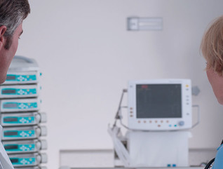 Doctor and nurse talking in intensive care