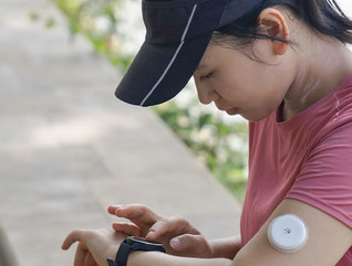 Person wearing glucose monitor 