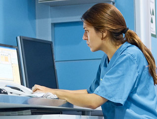 Nurse working on computer in hospital