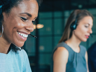 Female wearing headphones working in office