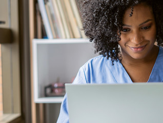 clinician on laptop