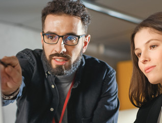 IT team look at cloud usage on a computer monitor