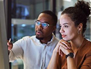 IT team members look at platform on desktop