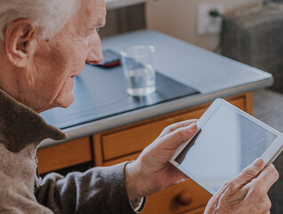 Senior using Digital Tablet