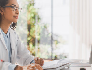 doctor on computer monitor in office