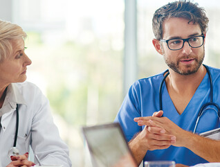 Healthcare team discussing at a table