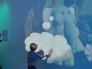 child plays with projection at hospital