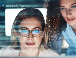 IT staff look at malicious code