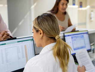 Doctors using computers at a hospital