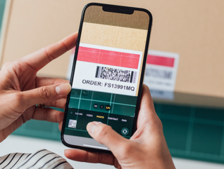 person scans barcode with phone