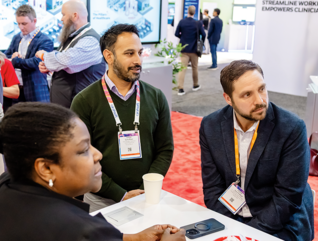 HIMSS25 attendees network on exhibit floor