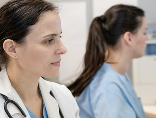 Doctors using computers in a hospital