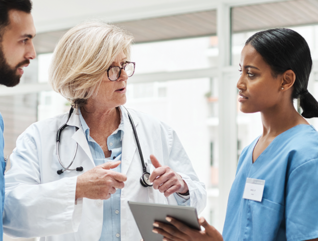 Care Team Collaborates with Data on Tables