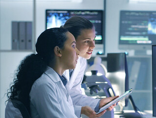 Doctors reviewing information on devices
