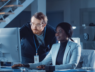 IT team confers over monitor