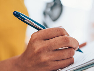 Person with a clipboard checking a list